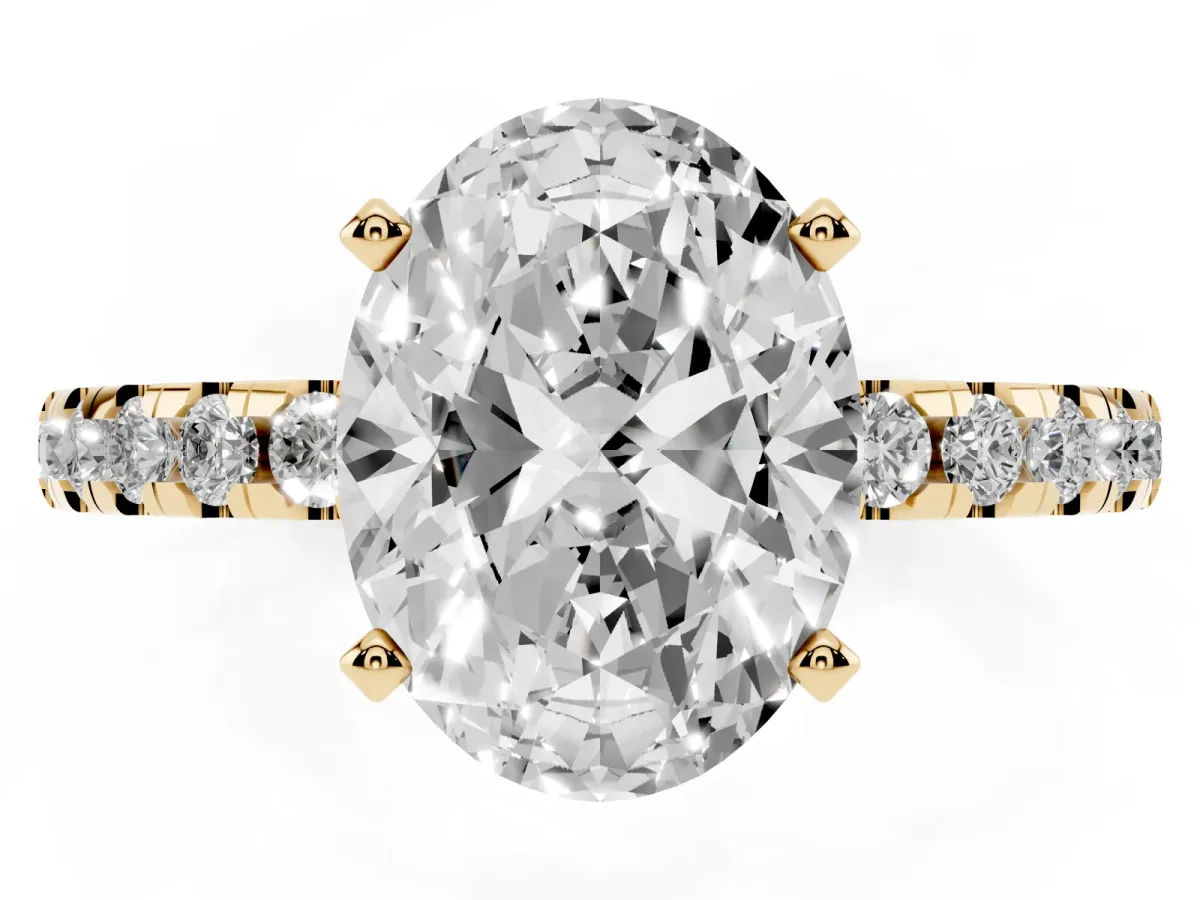 Oval Cut Diamond Solitaire Ring with Round Pavé Band and Four-Prong Setting Yellow gold