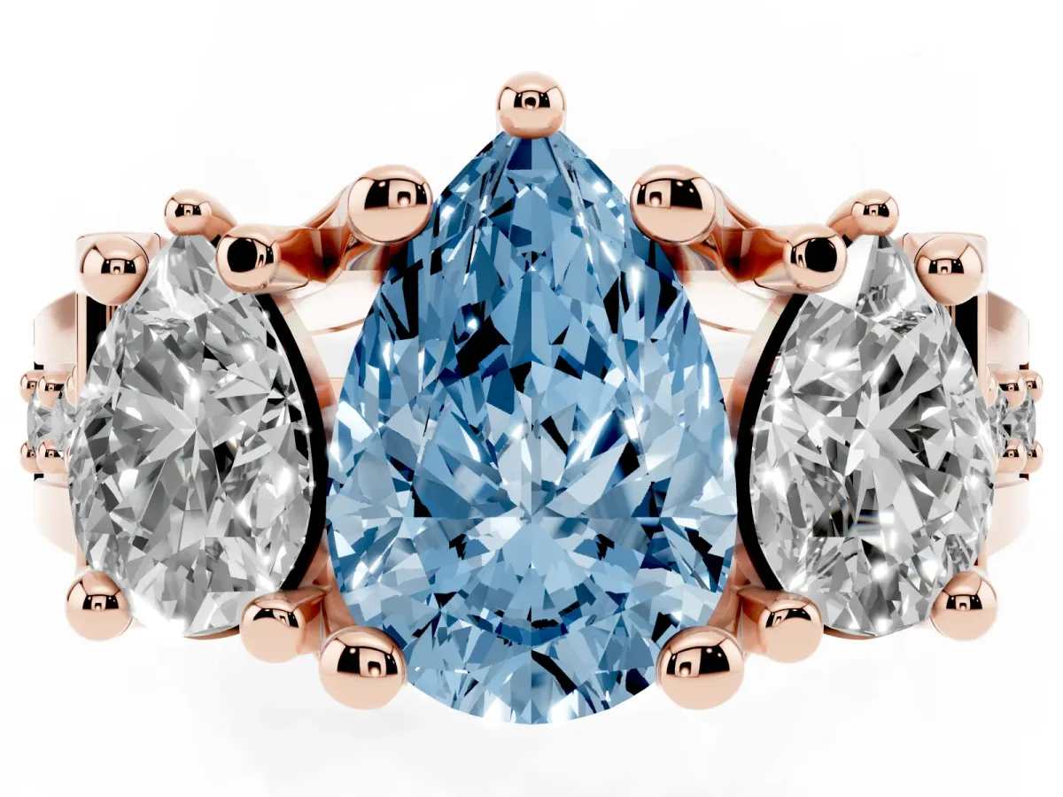 Fancy Blue Pear Cut Diamond Three-Stone Ring with Channel Set Band and Four-Prong Setting Rose gold