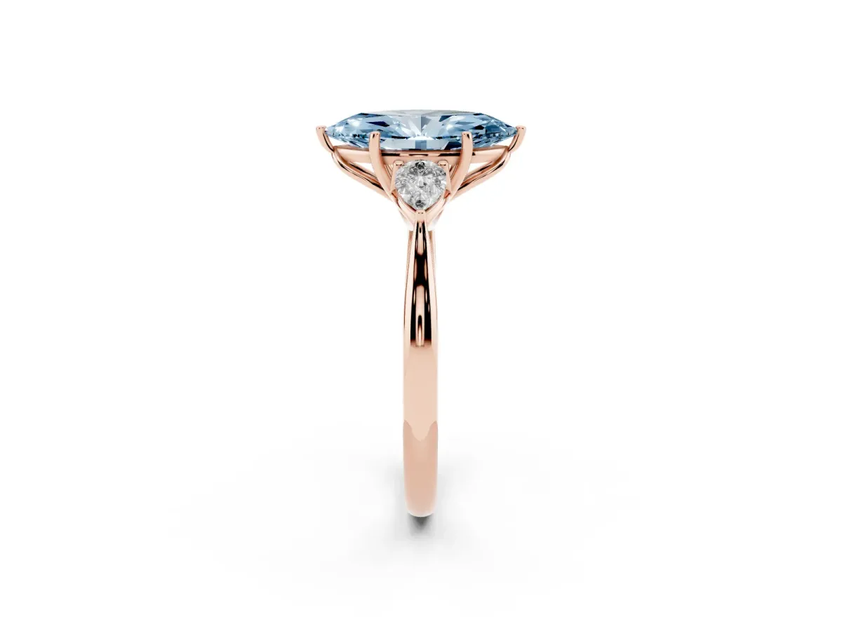 Fancy Blue Three-Stone Marquise Cut Diamond Ring with Pear Side Stones in Four-Prong Setting Rose gold