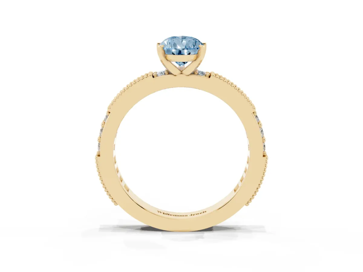 Fancy Blue Pear Cut Solitaire with Pavé Band and Four-Prong Setting Yellow gold