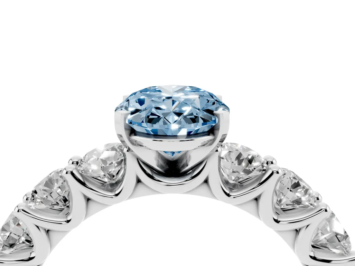 Fancy Blue Oval Cut Diamond Prong Setting with Side Stones on a Pave Band Silver