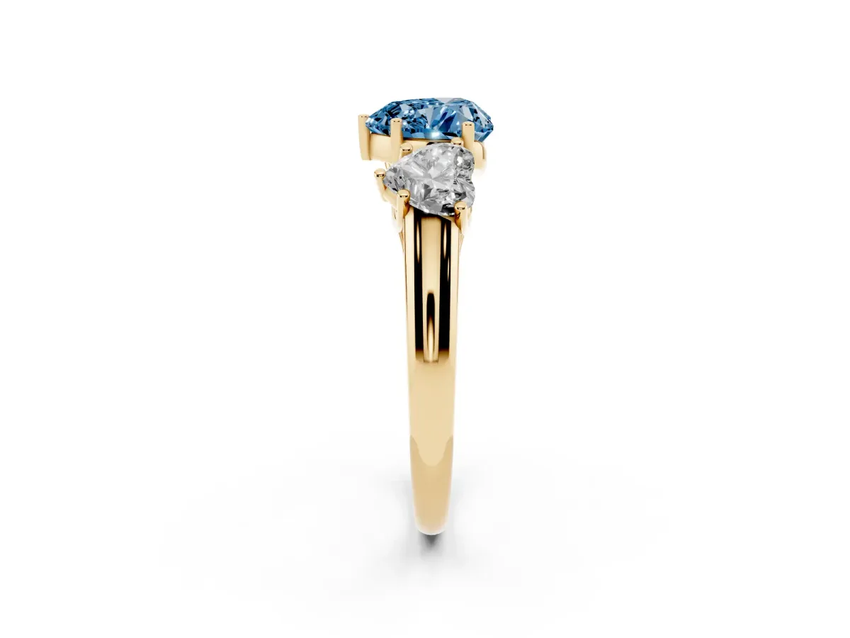 Fancy Blue Three-Stone Heart Cut Diamond Engagement Ring with Prong Setting Yellow gold