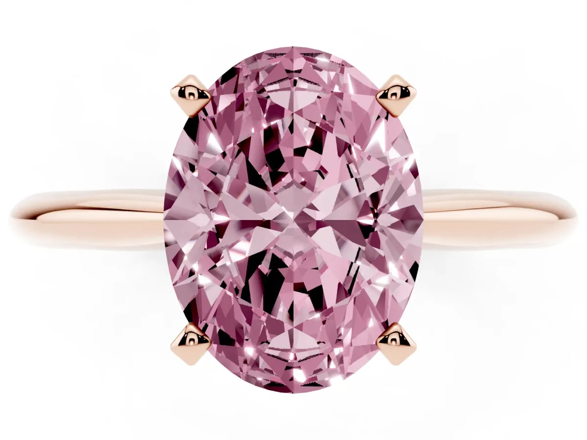 Fancy Pink Oval Cut Cut Solitaire Ring with Four-Prong Setting on a Classic Band Rose gold