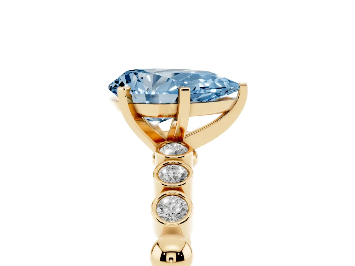 Fancy Blue Pear Cut Solitaire Bezel Accent Diamond Engagement Ring with Beaded Band and Four-Prong Setting Yellow gold