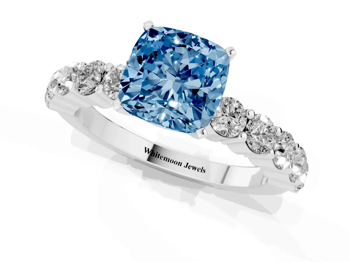 Fancy Blue Cushion Cut Diamond Solitaire Ring with Shared Prong Round Side Stones Platinum