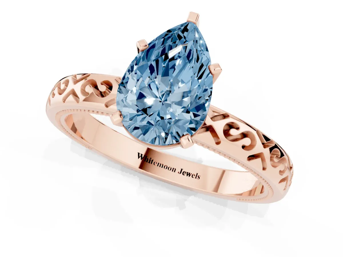 Fancy Blue Pear Cut Solitaire Engagement Ring with Scrollwork Band and Four-Prong Setting Rose gold