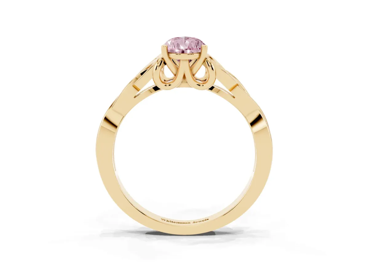 Fancy Pink Pear Cut Diamond Solitaire Engagement Ring with Celtic Knot Band and Four-Prong Setting Yellow gold