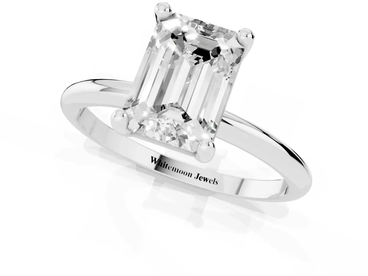 Emerald Cut Solitaire Diamond Ring with 4-Prong Setting on a Classic Band Silver