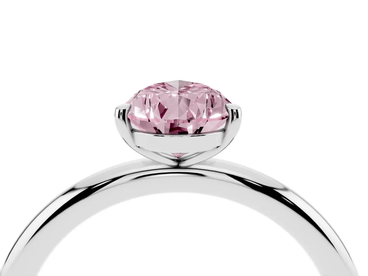 Fancy Pink Pear Cut Solitaire Diamond Ring with Four-Prong Setting on a Plain Band Platinum