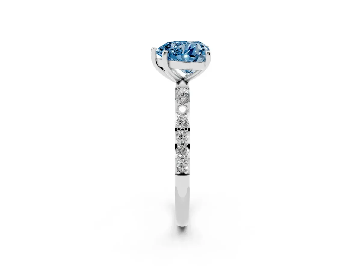 Fancy Blue Heart Cut Diamond Solitaire Ring with Round Pavé Shoulders and Prong Setting Silver