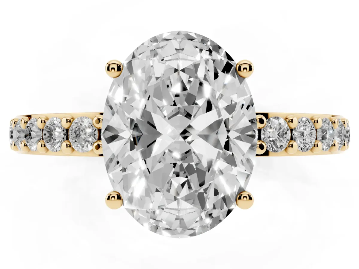 Oval Cut Cut Diamond Solitaire with Pave Band and Four-Prong Setting Yellow gold