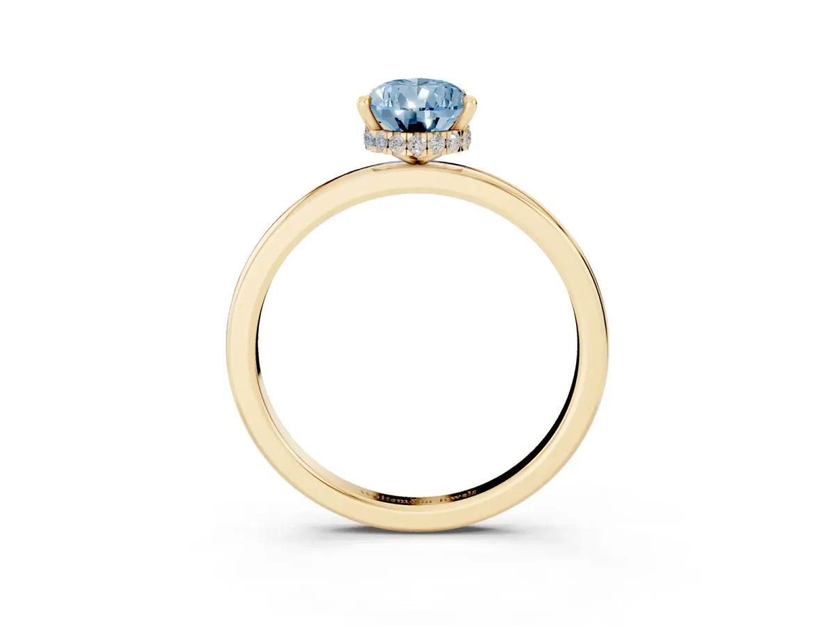 Fancy Blue Pear Cut Solitaire Engagement Ring with Cathedral Band and Four-Prong Setting Yellow gold