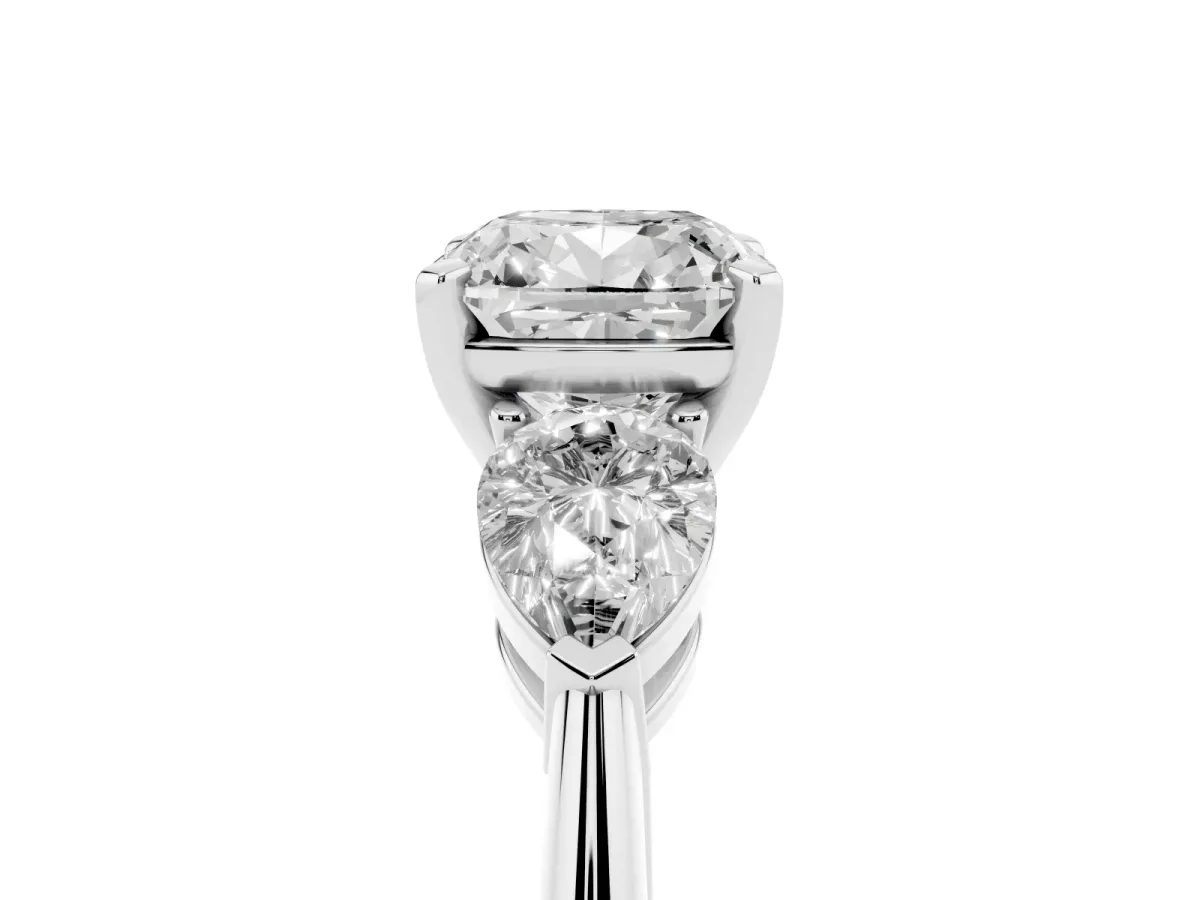 Three-Stone Cushion Cut Diamond Ring with Pear Side Stones and Four-Prong Setting Platinum