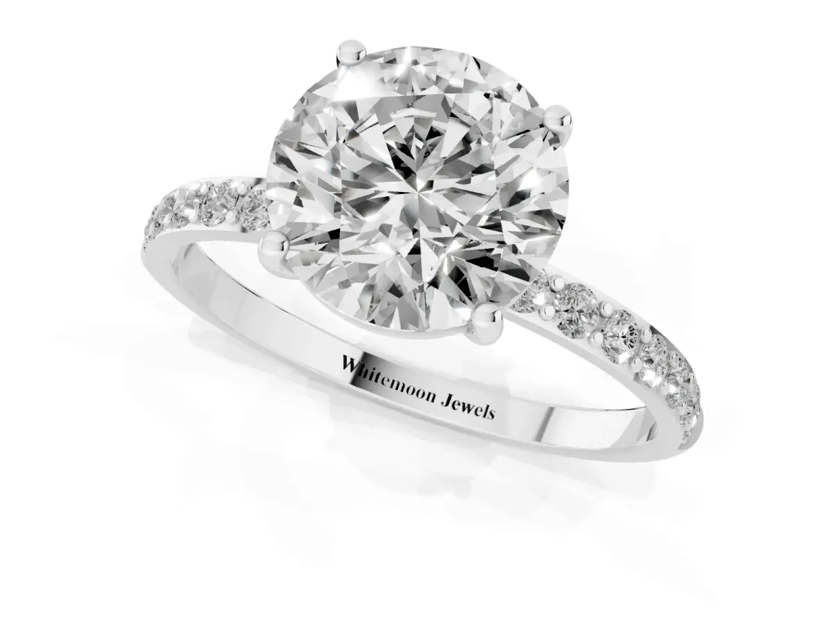Round Cut Diamond Solitaire Ring with Round Pavé Shoulders and Prong Setting Platinum