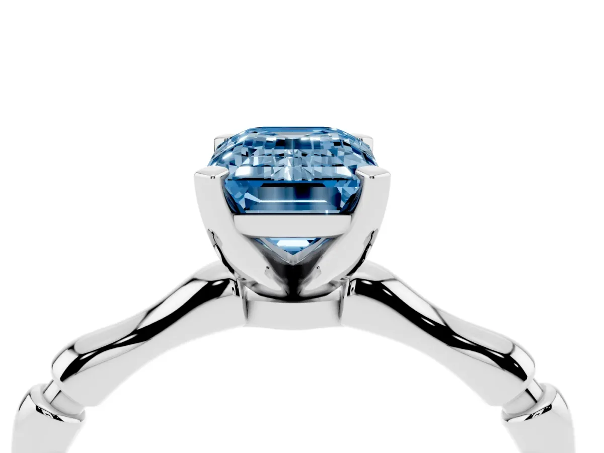 Fancy Blue Emerald Cut Solitaire Diamond Ring with Bamboo Band and Four-Prong Setting Platinum