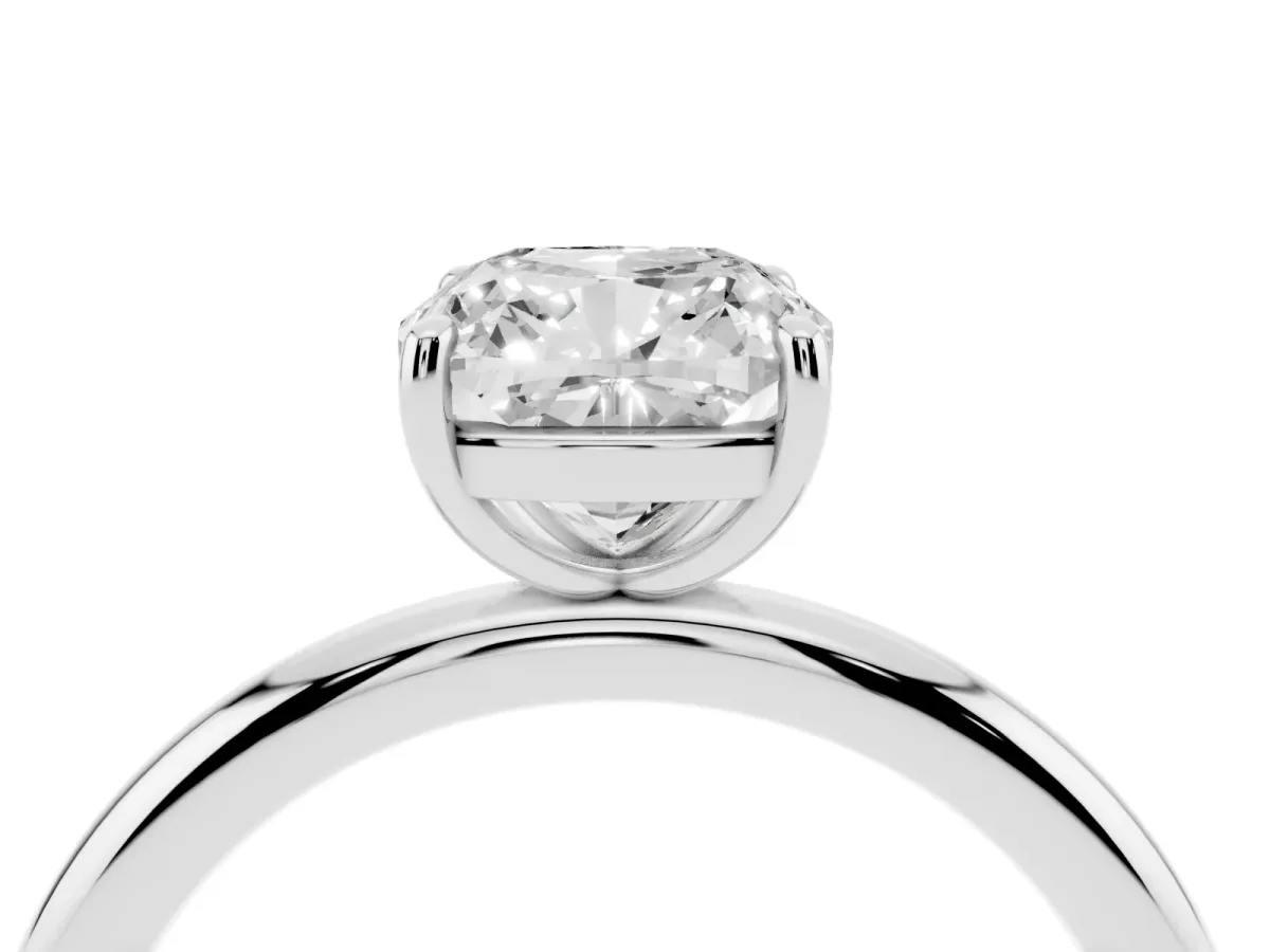Cushion Cut Solitaire Diamond Ring with Four-Prong Setting on a Plain Band Platinum