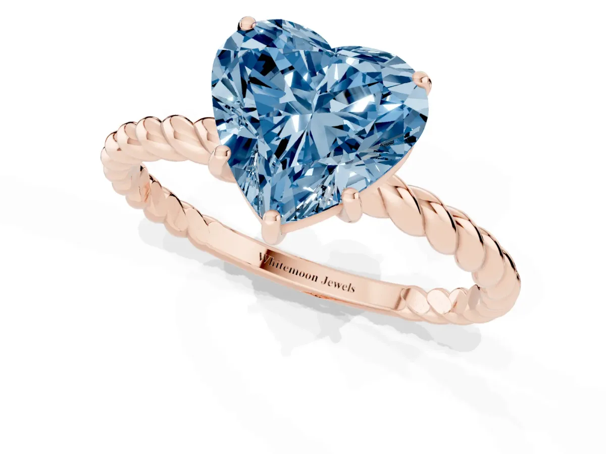 Fancy Blue Heart Cut Solitaire Twist Band Ring with Four-Prong Setting Rose gold