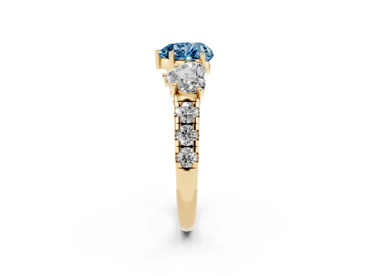 Fancy Blue Three-Stone Heart Cut Diamond Pavé Band with Prong Setting Yellow gold