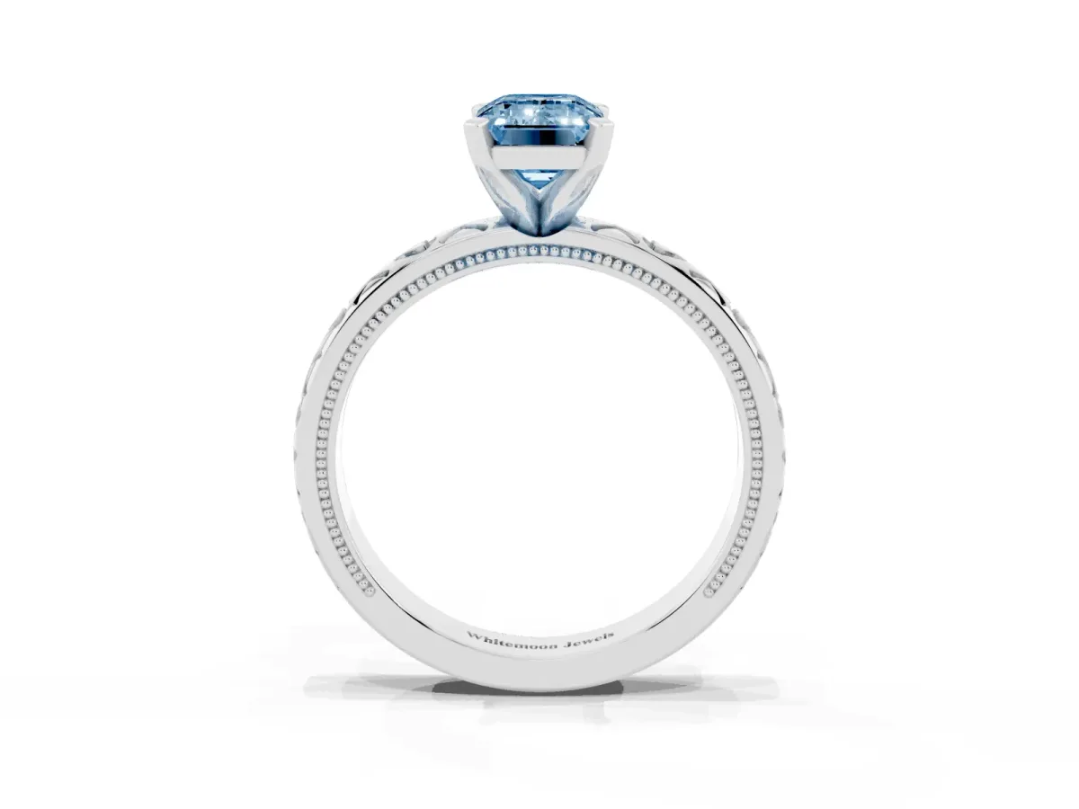 Fancy Blue Emerald Cut Solitaire Diamond Engagement Ring with XO Engraved Band and Four-Prong Setting Silver