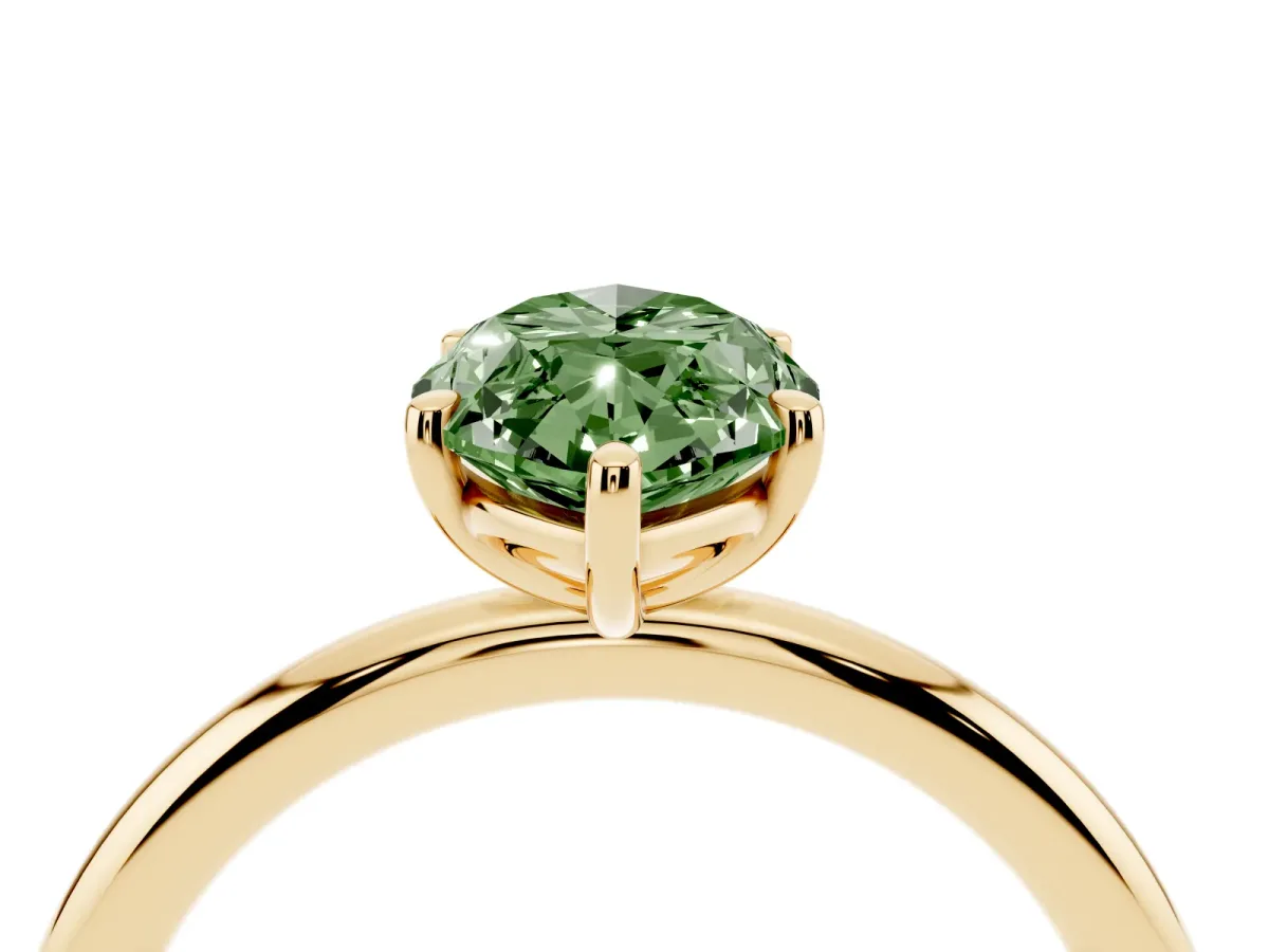 Fancy Green Oval Cut Solitaire Diamond Ring with Four-Prong Setting on a Plain Band Yellow gold