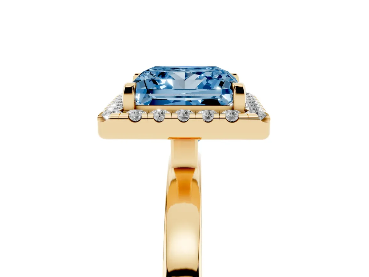 Fancy Blue Princess Cut Halo Diamond Solitaire with Pavé Band and Four-Prong Setting Yellow gold