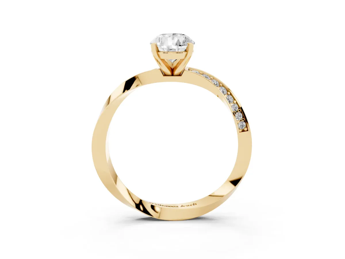 Pear Cut Diamond Engagement Ring with Side Stone Accents and Four-Prong Setting Yellow gold