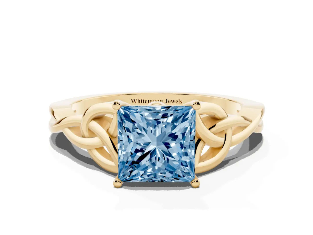 Fancy Blue Princess Cut Diamond Solitaire Engagement Ring with Celtic Knot Band and Four-Prong Setting Yellow gold