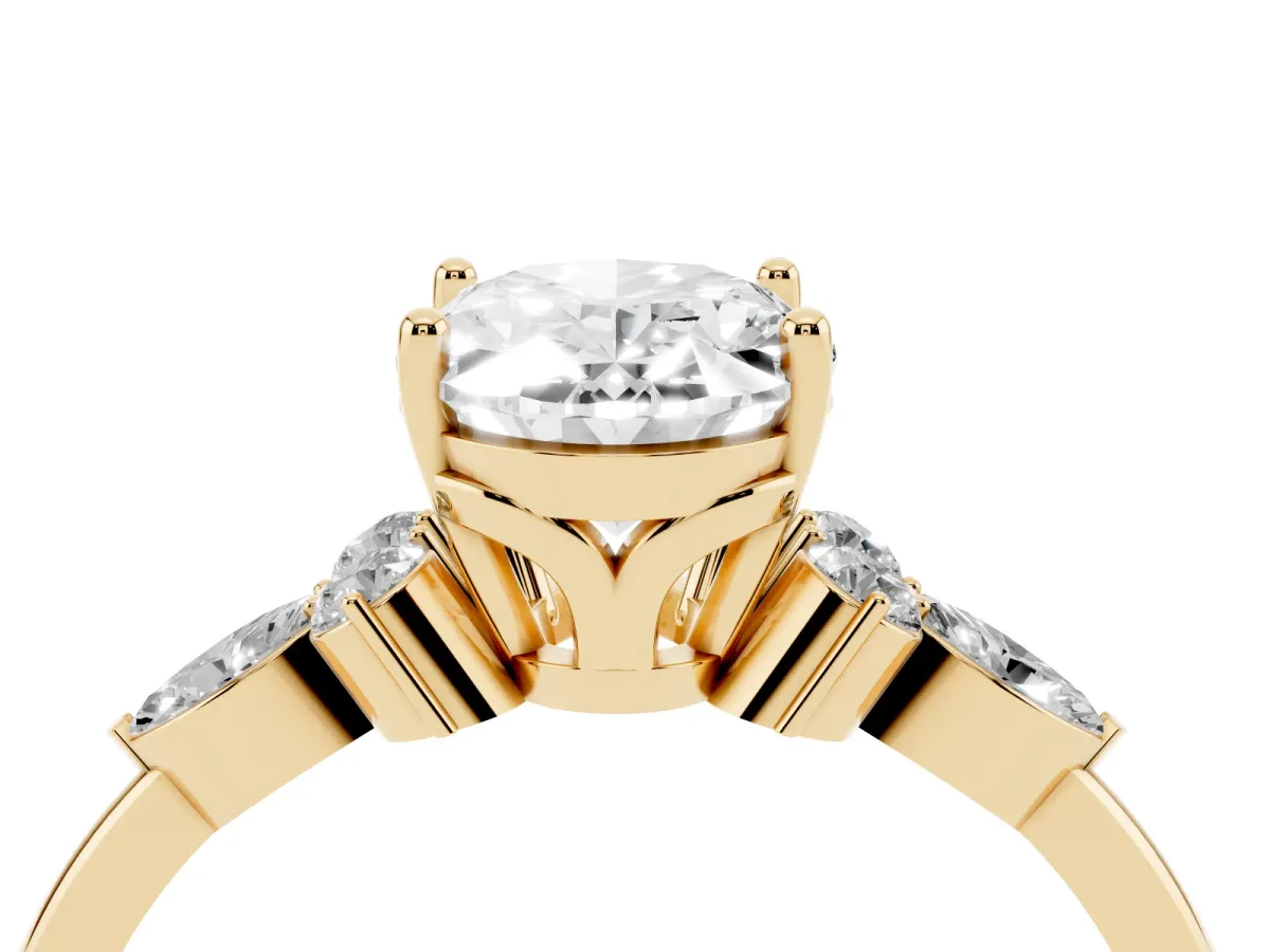 Oval Cut Brilliant Diamond Solitaire Ring with Pear Side Stones and Four-Prong Setting Yellow gold