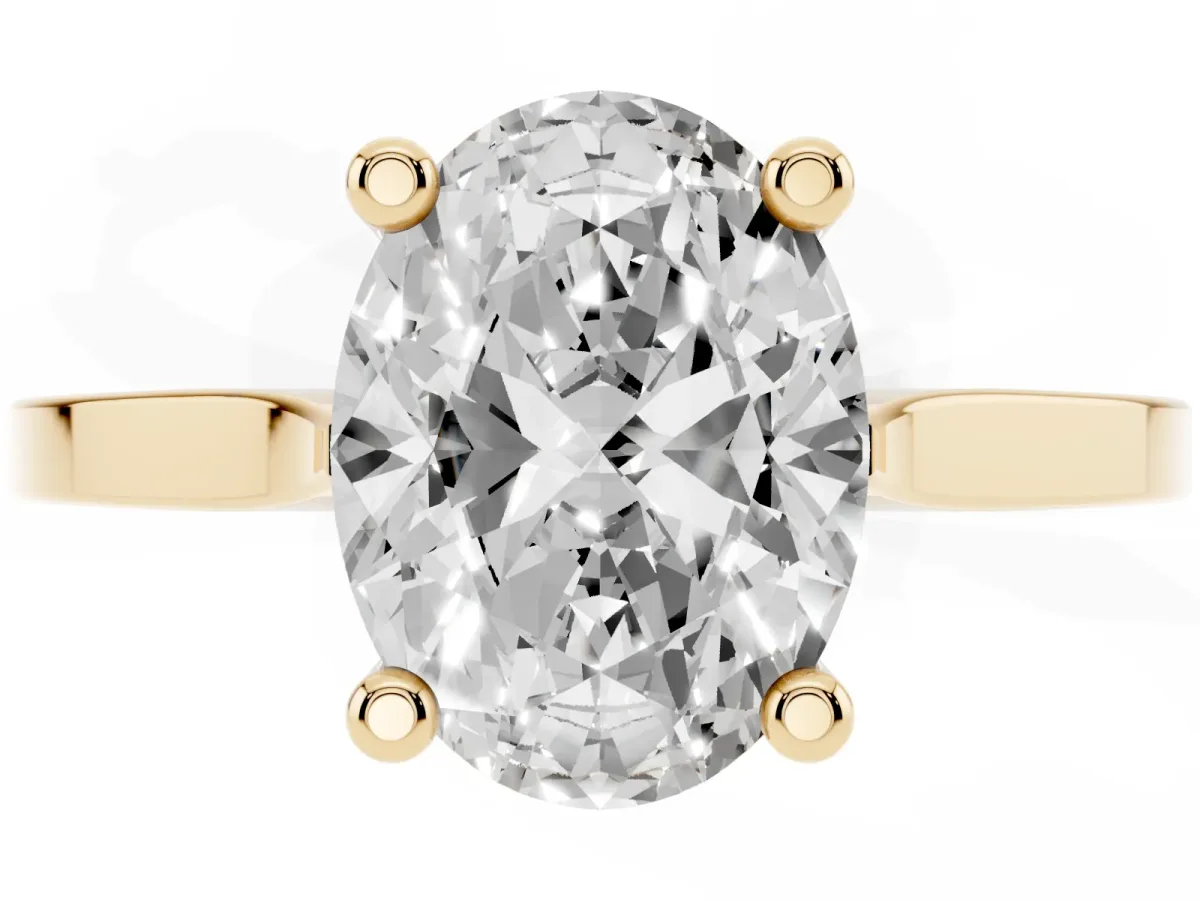 Oval Cut Solitaire Diamond Ring with Four-Prong Setting and Tapered Band Yellow gold