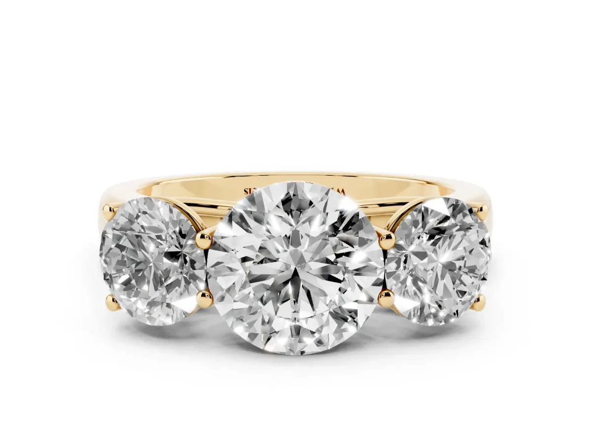 Round Cut Three-Stone Diamond Ring with Prong Setting on a Classic Band Yellow gold