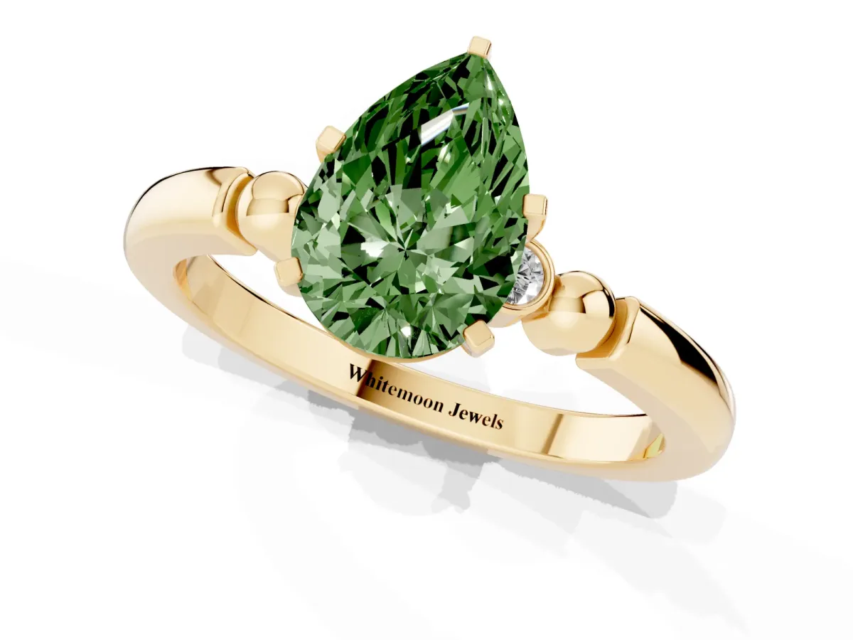 Fancy Green Pear Cut Solitaire Beaded Band with Four-Prong Setting Yellow gold