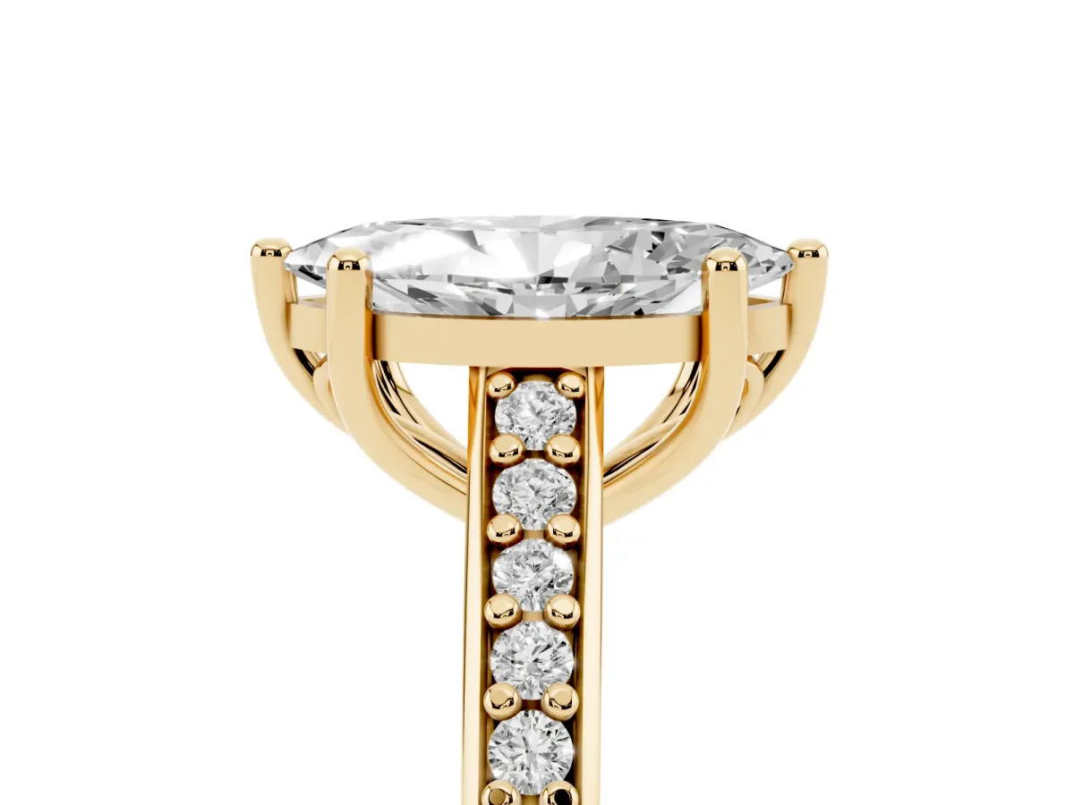 Marquise Cut Solitaire Prong Set Diamond Engagement Ring with Pave Band Yellow gold