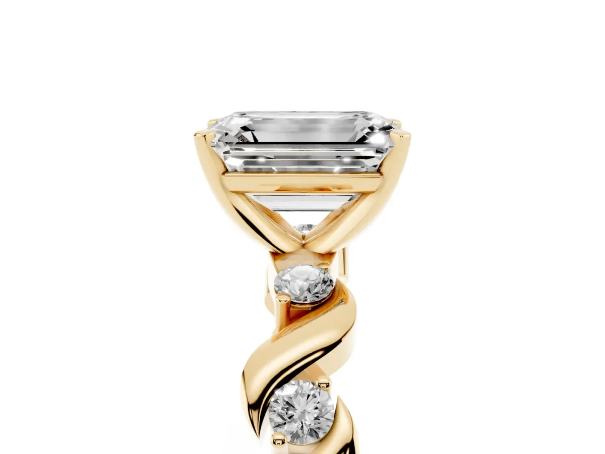 Emerald Cut Diamond Solitaire Twisted Band with Round Accents and Prong Setting Yellow gold