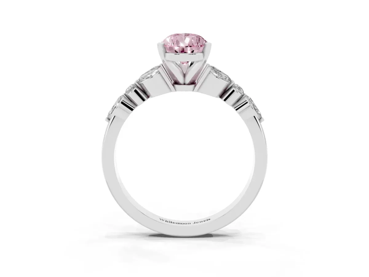 Fancy Pink Pear Cut Diamond Solitaire Ring with Side Stones and Four-Prong Setting Platinum