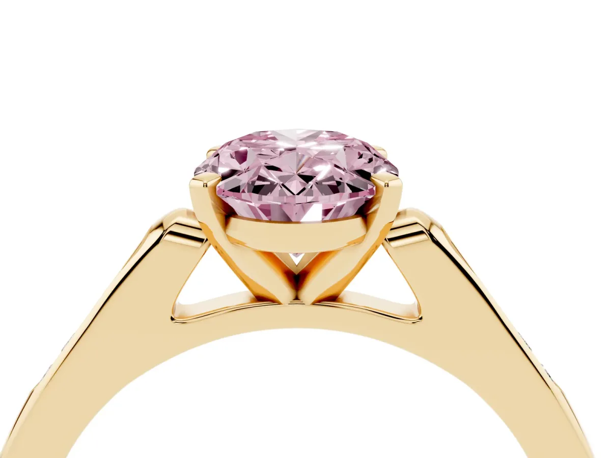 Fancy Pink Oval Cut Diamond Solitaire Ring with Channel Set Round Band and Prong Setting Yellow gold
