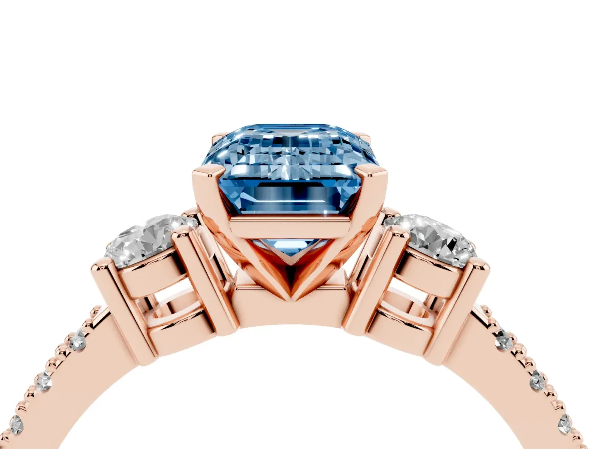 Fancy Blue Emerald Cut Three-Stone Diamond Pavé Band with Prong Setting Rose gold