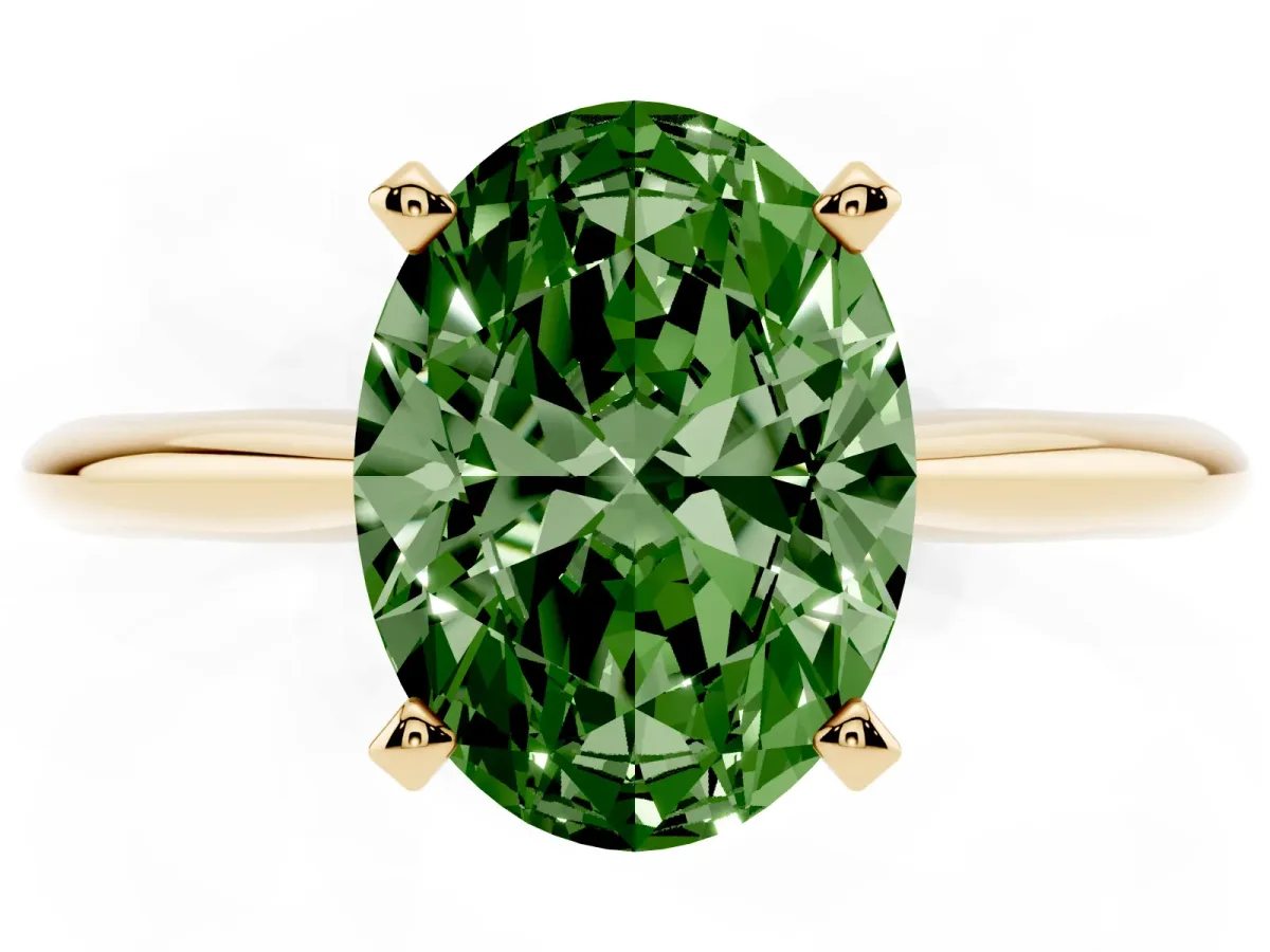 Fancy Green Oval Cut Cut Solitaire Ring with Four-Prong Setting on a Classic Band Yellow gold