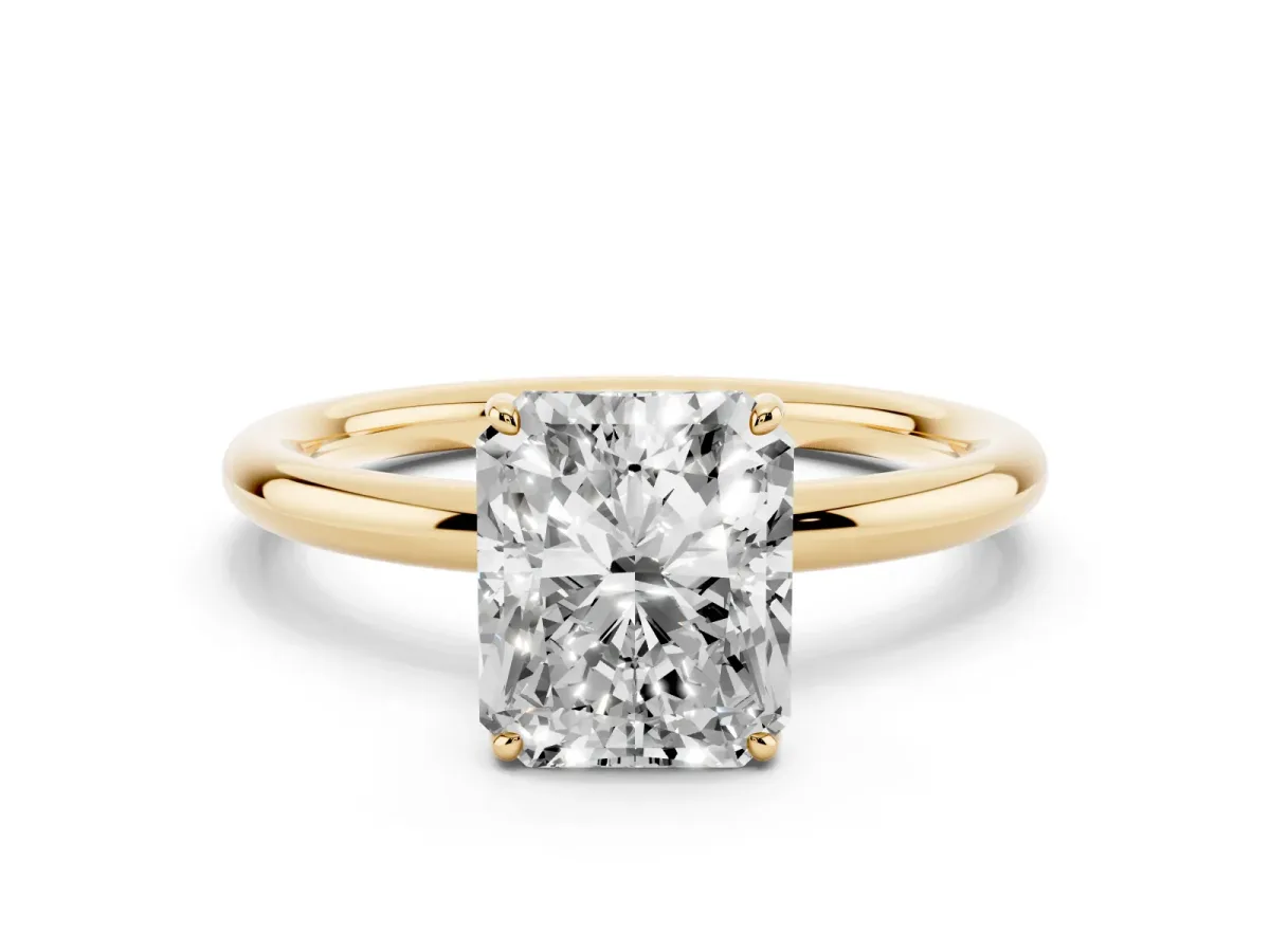 Radiant Cut Solitaire Diamond Ring with Four-Prong Setting on a Plain Band Yellow gold