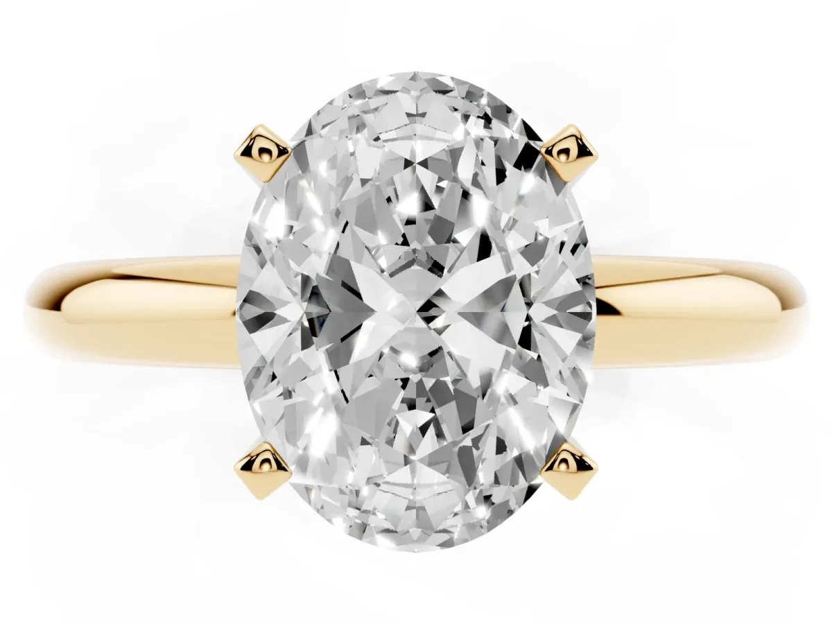 Oval Cut Diamond Solitaire Engagement Ring with Round Band and Four-Prong Setting Yellow gold
