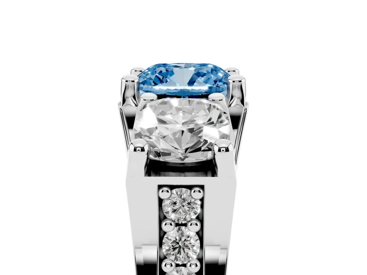 Fancy Blue Cushion Cut Diamond Three-Stone Ring with Channel Set Band and Four-Prong Setting Silver