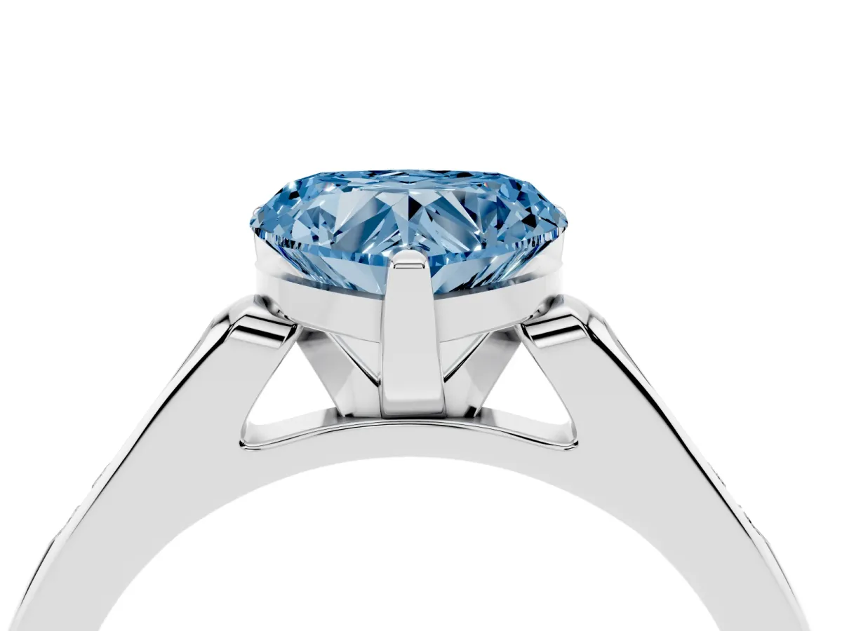 Fancy Blue Heart Cut Diamond Solitaire Ring with Channel Set Round Band and Prong Setting Silver
