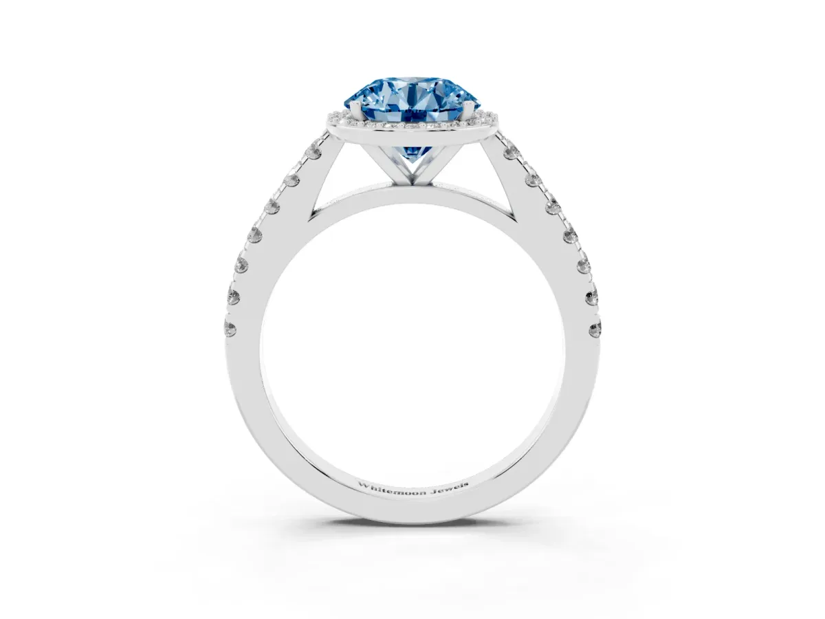 Fancy Blue Round Cut Cut Halo Diamond Engagement Ring with Pave Band and Four-Prong Setting Silver