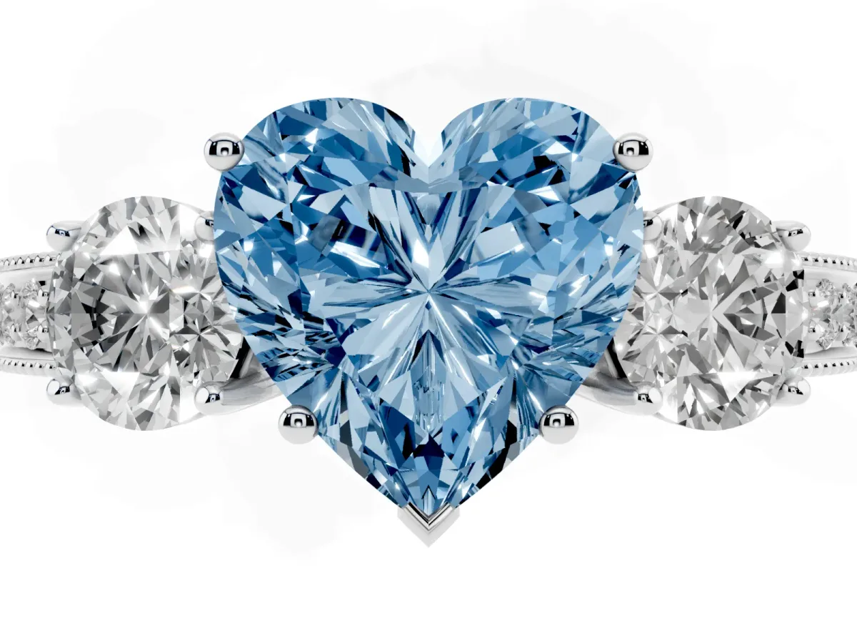 Fancy Blue Heart Cut Three-Stone Diamond Ring with Pavé Band and Four-Prong Setting Silver