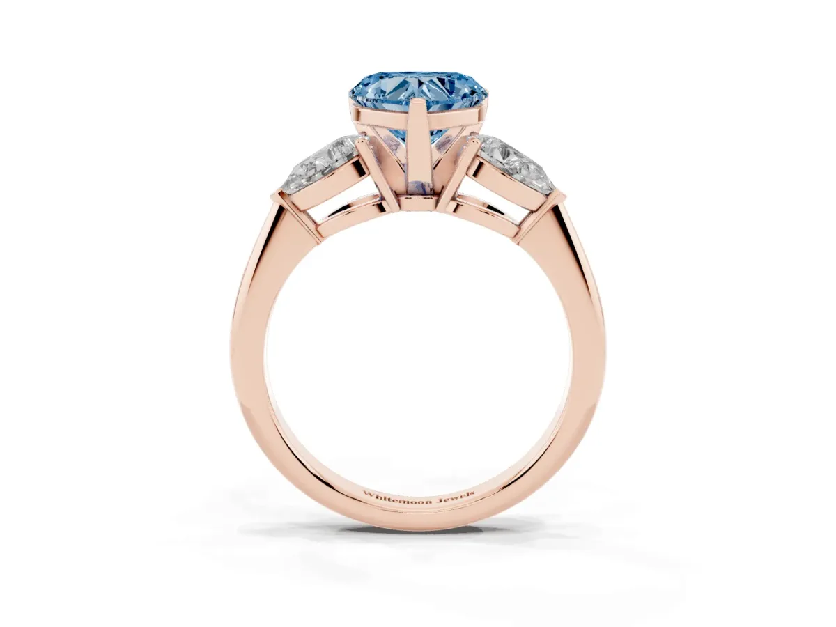 Fancy Blue Three-Stone Heart Cut Diamond Ring with Pear Side Stones and Four-Prong Setting Rose gold