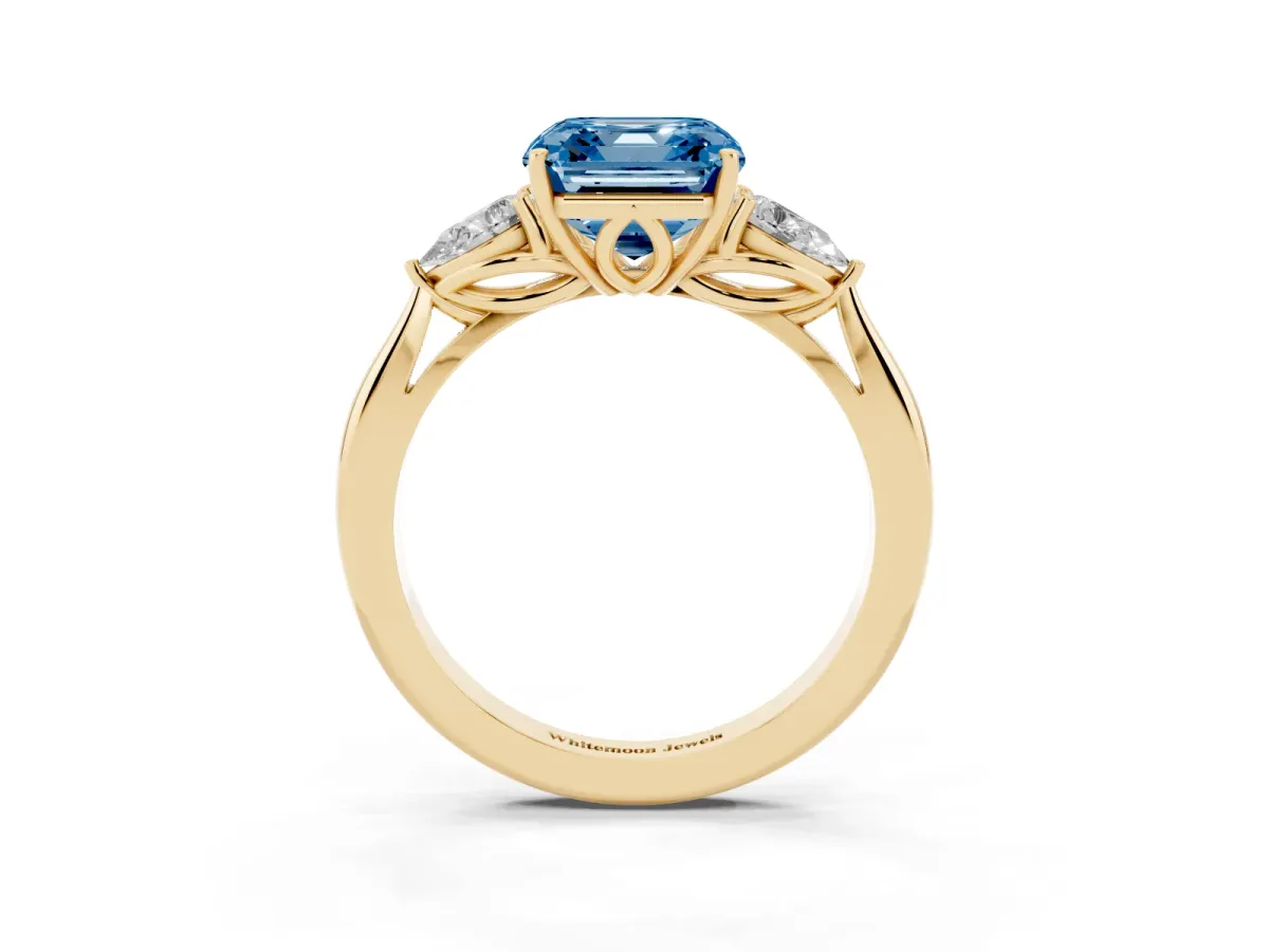 Fancy Blue Asscher Cut Diamond Three-Stone Ring with Pear Side Stones and Prong Setting Yellow gold