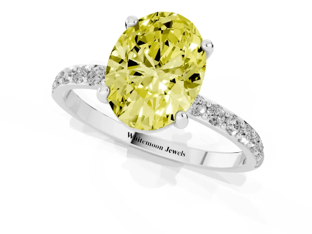 Fancy Yellow Oval Cut Diamond Solitaire Ring with Round Pavé Band and Prong Setting Platinum