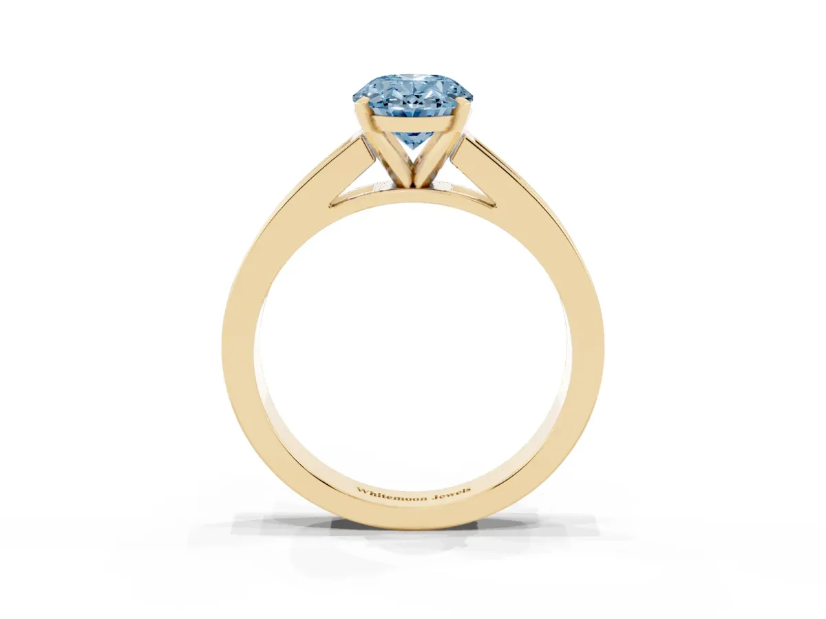 Fancy Blue Oval Cut Solitaire Diamond Ring with Channel-Set Band and Four-Prong Setting Yellow gold