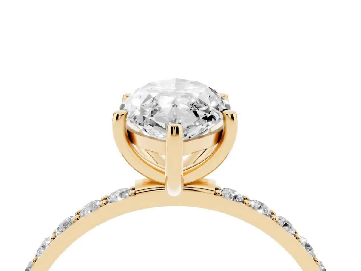 Marquise Cut Diamond Solitaire Ring with Round Pavé Shoulders and Prong Setting Yellow gold