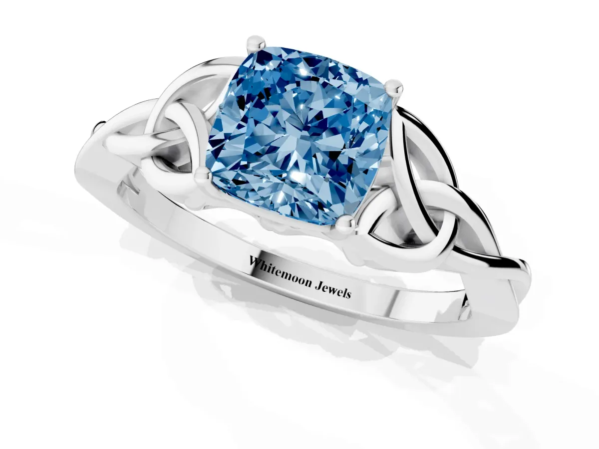 Fancy Blue Cushion Cut Diamond Solitaire Engagement Ring with Celtic Knot Band and Four-Prong Setting Silver