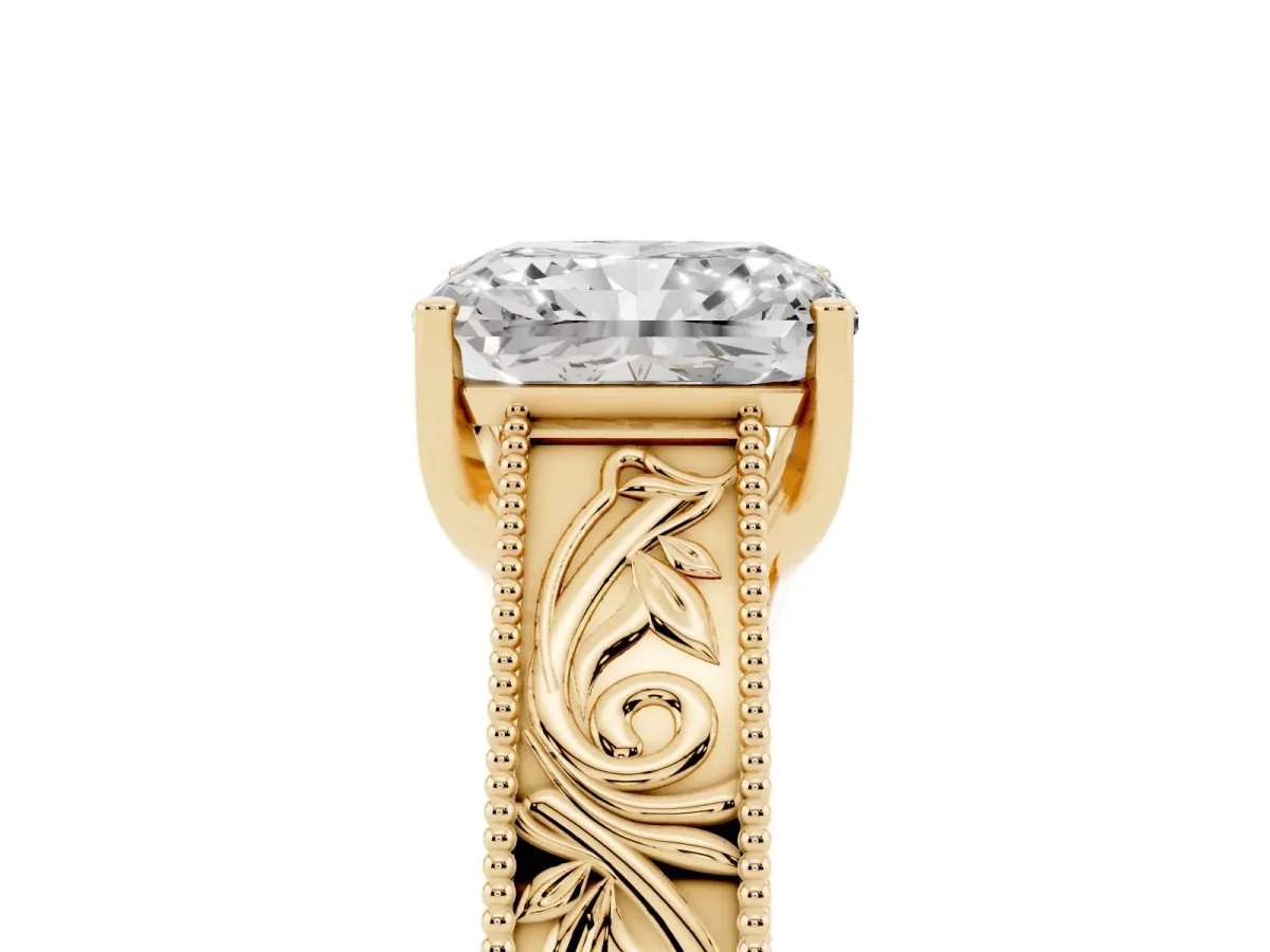 Radiant Cut Diamond Solitaire Ring with Engraved Band and Four-Prong Setting Yellow gold